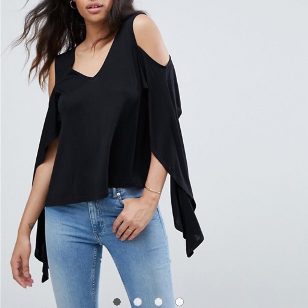 Black top with cold shoulders and dramatic flair